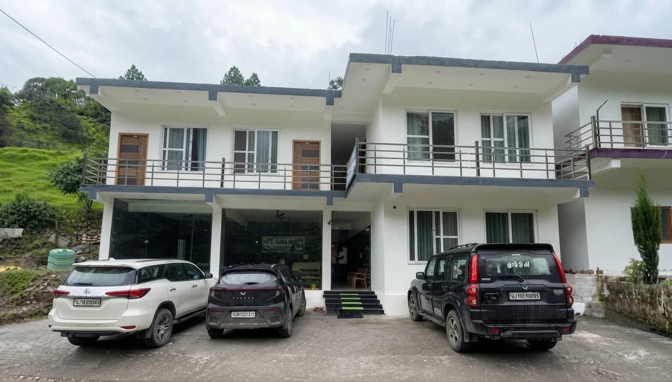 Ganga Niwas Hotel exterior with mountain view
